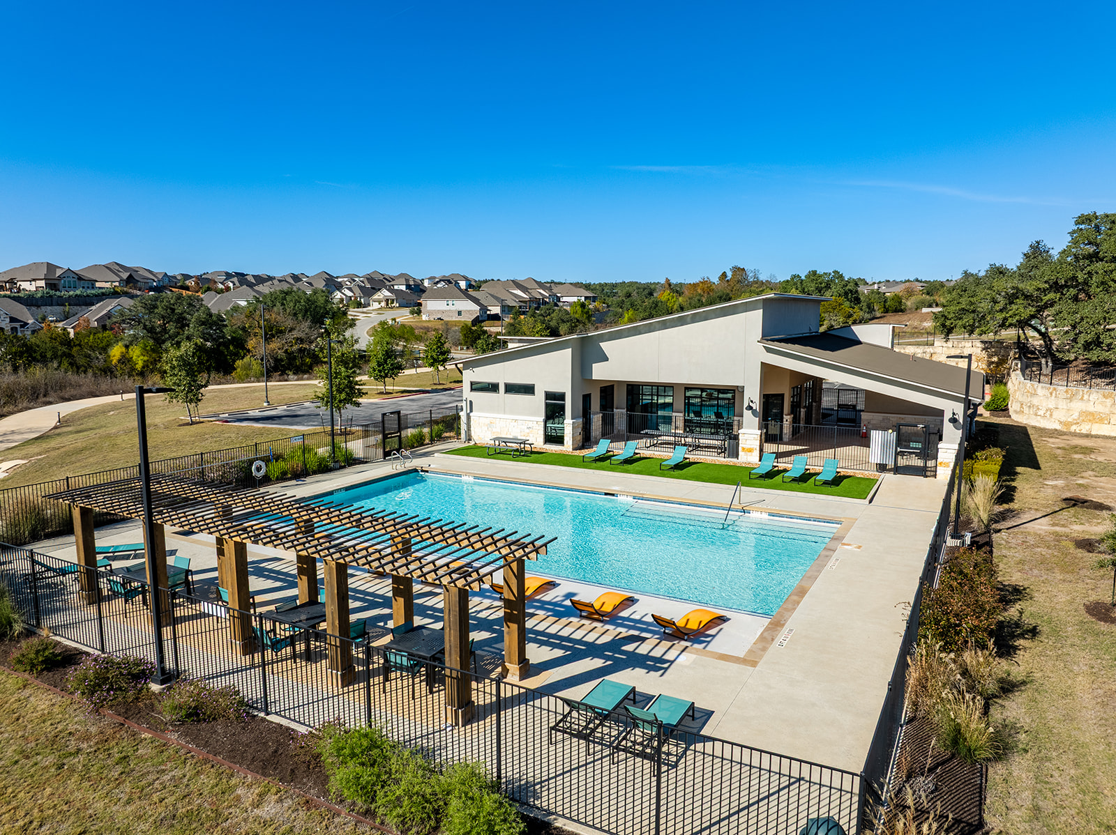 Water Oak community pool and clubhouse with pergola and lounge chairs
